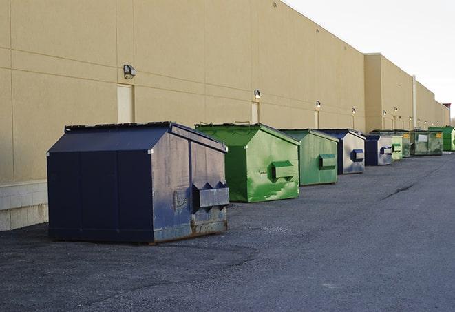 a collection of bright and vibrant dumpsters in a construction zone in Celebration, FL